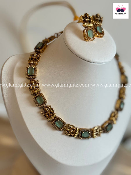 Laxmi Motif Choker with green Stone – Matte Gold Finish