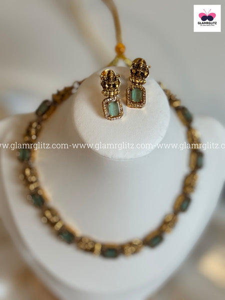 Laxmi Motif Choker with green Stone – Matte Gold Finish